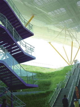The outdoor violet steel stair under the sunshine in green surroundings